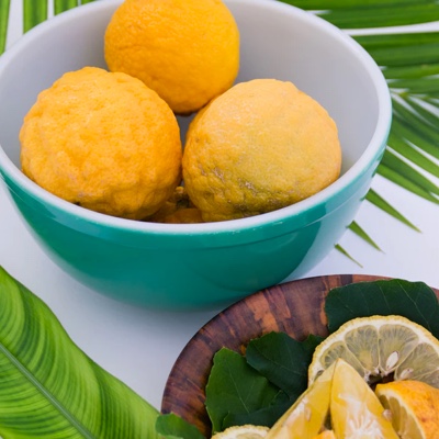 deliciously looking rice balls served among banana leaves 